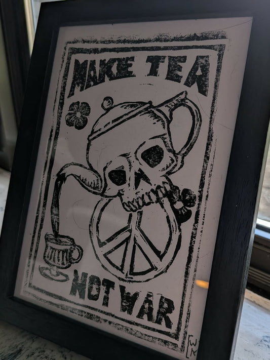Make Tea Not War Framed Print